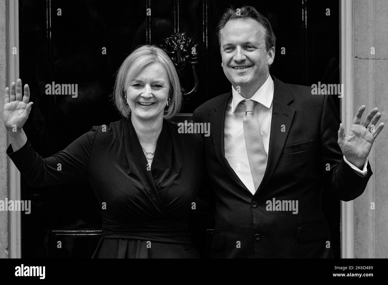 Liz Truss, British Prime Minister, with husband Hugh O'Leary, waving and smiling outside 10 Downing Street on her first day, London, United Kingdom Stock Photo