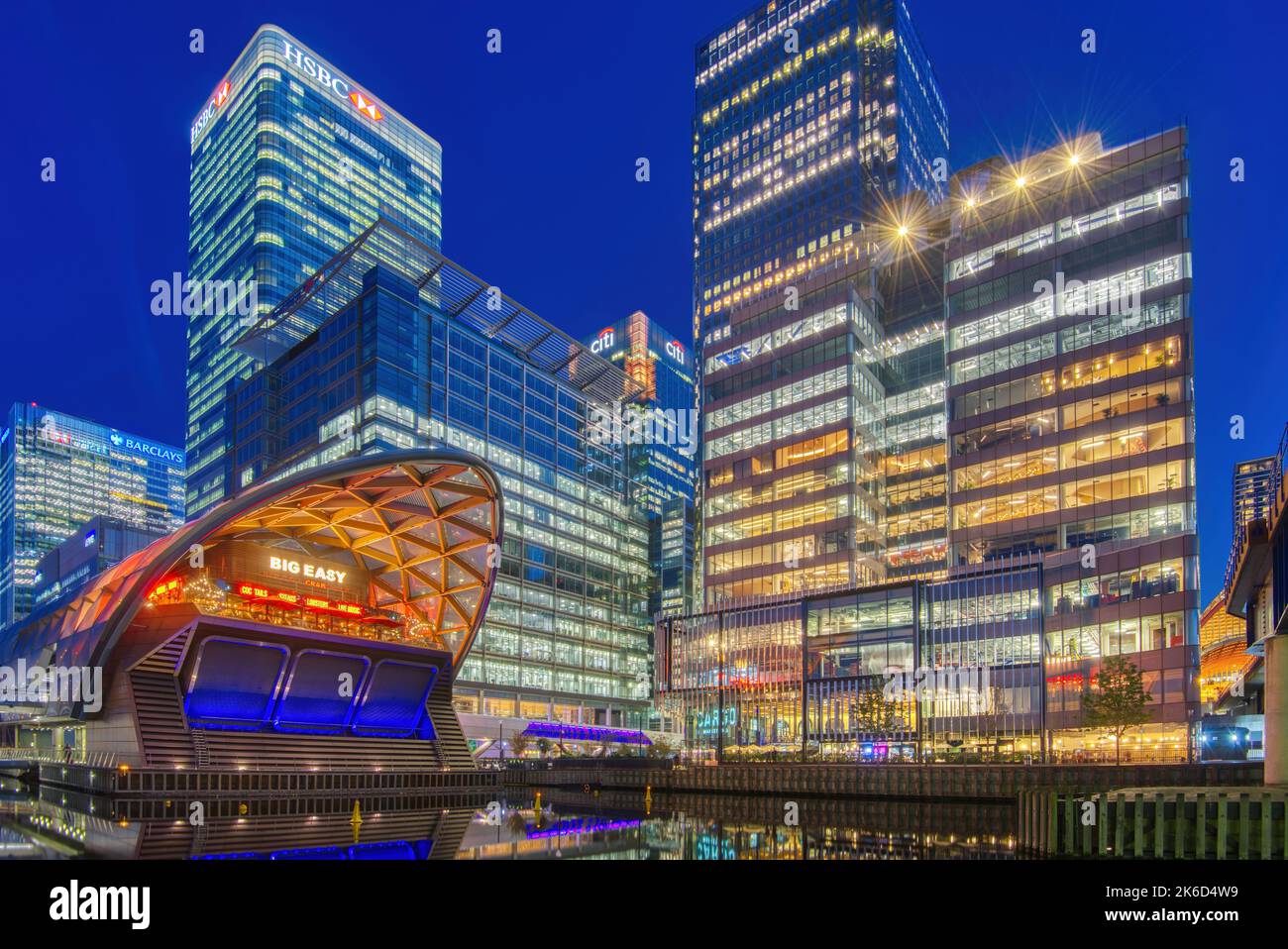 Twilight nighttime image of Canary Wharf London showing building lights. Stock Photo