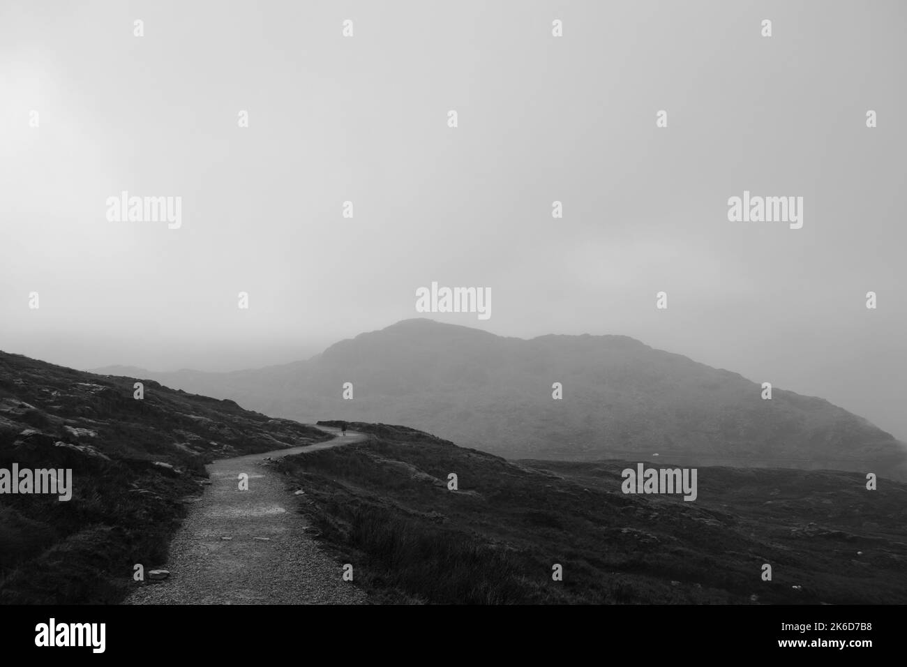 A landscape of a road through mountains in black and white Stock Photo ...