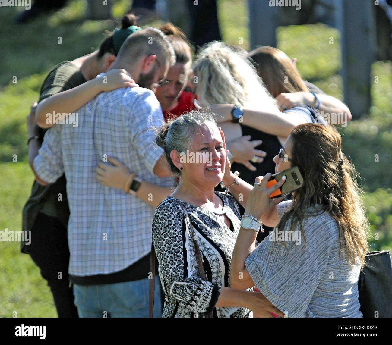 Parkland, USA. 14th Feb, 2018. Waiting for word from students at Coral Springs Drive and the Sawgrass Expressway just south of the campus of Stoneman Douglas High School in Parkland, Fla., after a shooting on Wednesday, Feb. 14, 2018. (Photo by Amy Beth Bennett/Sun Sentinel/TNS/Sipa USA) Credit: Sipa USA/Alamy Live News Stock Photo