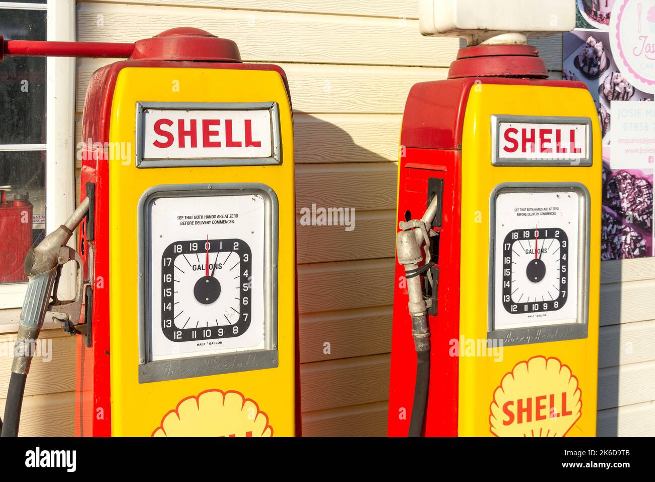 1950's Shell Oil pumps at John's Motors Classic Car Garage, Watling Street East, Towcester, Northamptonshire, England, United Kingdom Stock Photo