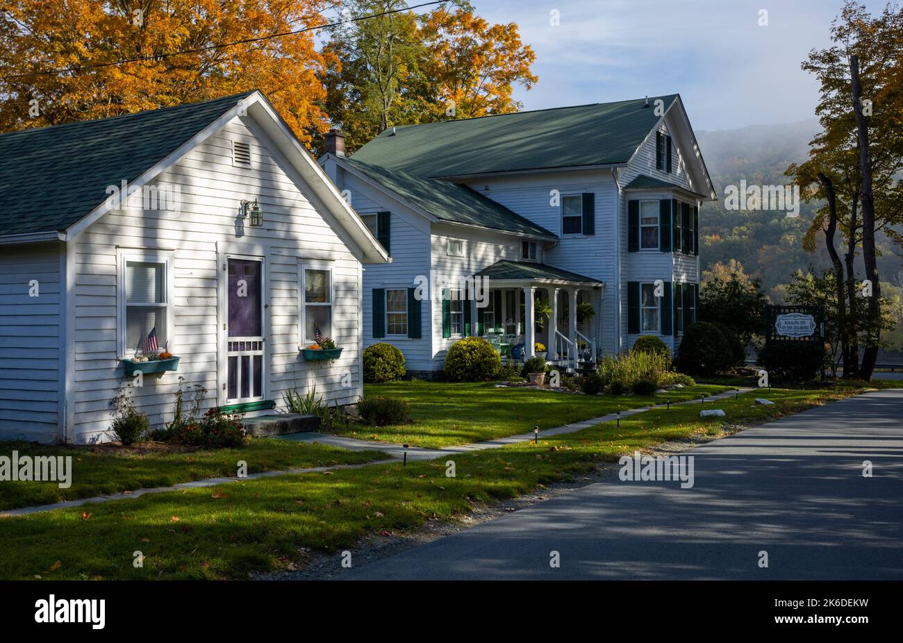 Lackawaxen, PA / USA - October 12, 2022:  1870 Roebling Inn Bed and Breakfast on the Delaware River on a brilliant fall morning Stock Photo