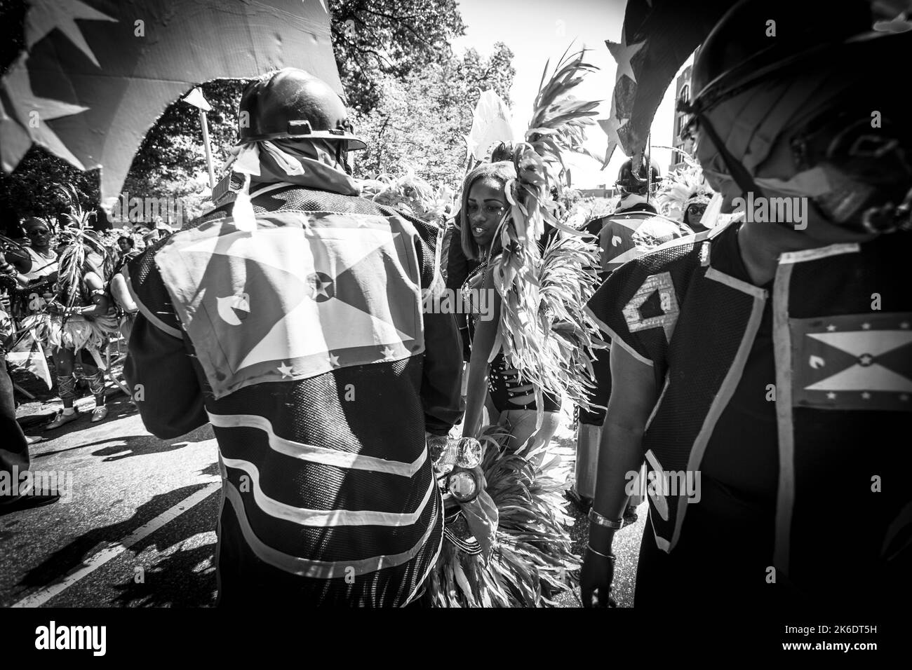 A grayscale shot of people at the Annual West Indian and Caribbean Day Parade and Carnival in Brooklyn Stock Photo