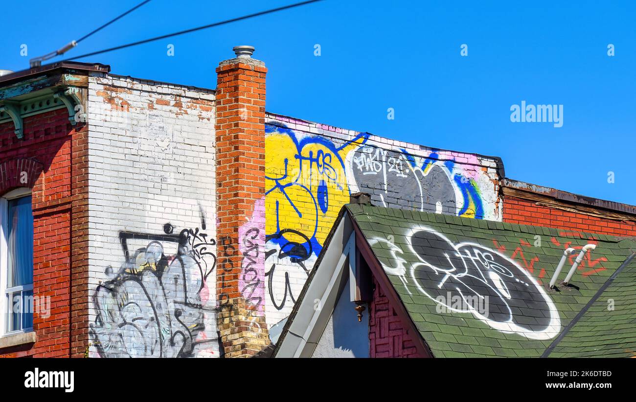 Chinatown, graffiti in a wall and a rooftop of buildings Stock Photo