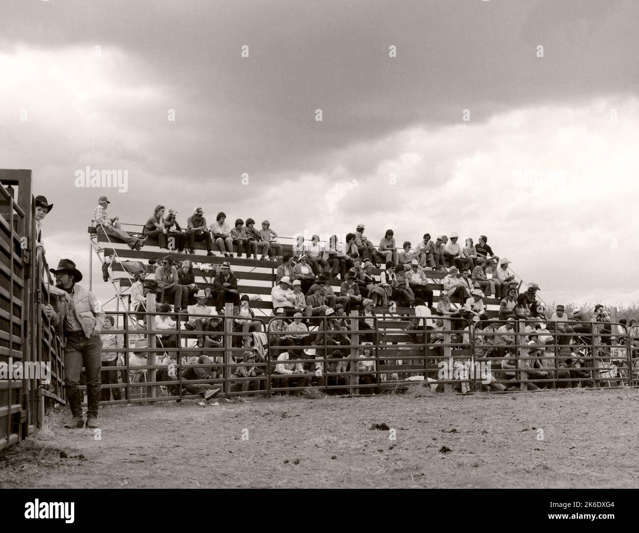 Rodeo spectators sitting in the wooden stands in rural alberta canada