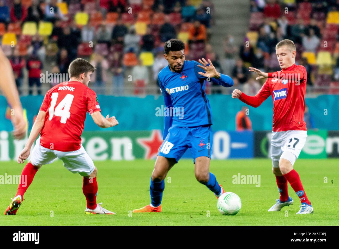 Bucharest, Romania. 13th Oct, 2022. October 13, 2022: Malcolm Edjouma #18 of FCSB and Sebastian Jorgensen #27 of Silkeborg IF during of the UEFA Europa Conference League group B match between FCSB Bucharest and Silkeborg IF at National Arena Stadium in Bucharest, Romania ROU. Catalin Soare/Cronos Credit: Cronos/Alamy Live News Stock Photo