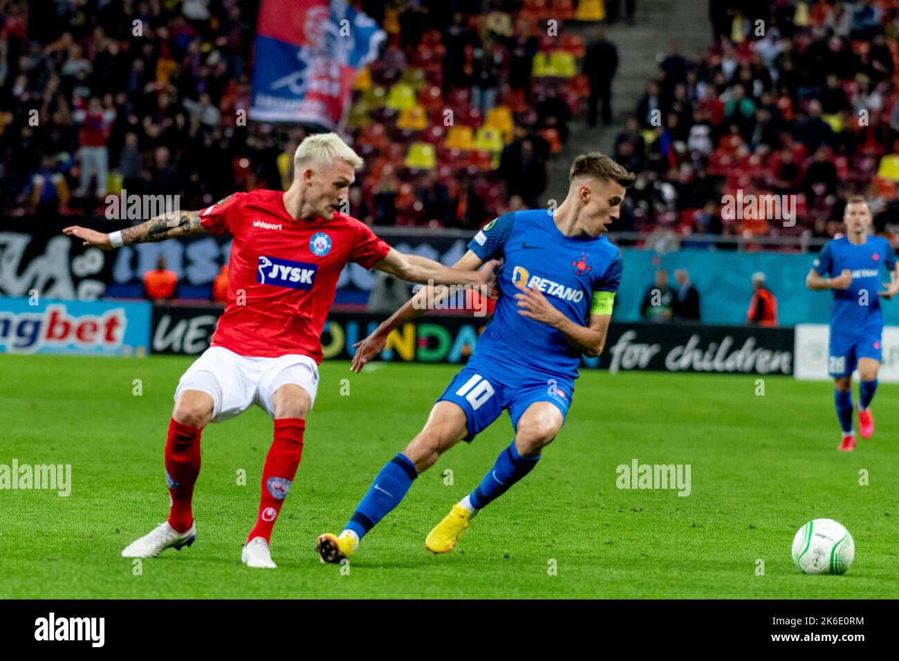 Bucharest, Romania. 13th Oct, 2022. October 13, 2022: Oliver Sonne #5 of Silkeborg IF and Octavian Popescu #10 of FCSB during of the UEFA Europa Conference League group B match between FCSB Bucharest and Silkeborg IF at National Arena Stadium in Bucharest, Romania ROU. Catalin Soare/Cronos Credit: Cronos/Alamy Live News Stock Photo