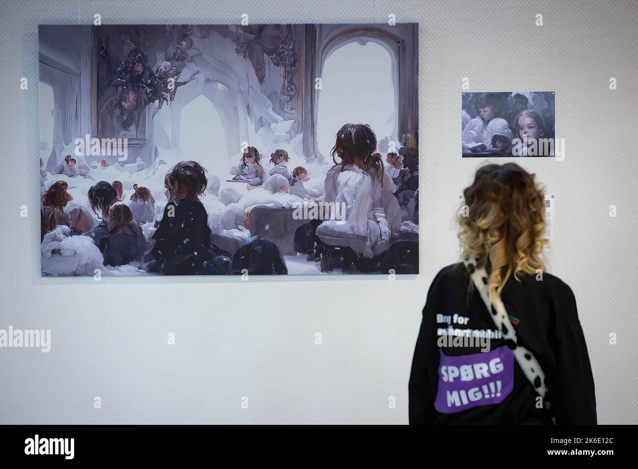 A girl looks at an image generated based on the stories of displaced children during the evacuation from hot spots in the south-east of Ukraine in Kyiv. The exhibition of these pictures is called 'Save Ukr(AI)ne'. On February 2022 Russian troops invaded Ukrainian territory starting a conflict that has provoked destruction and a humanitarian crisis. Stock Photo
