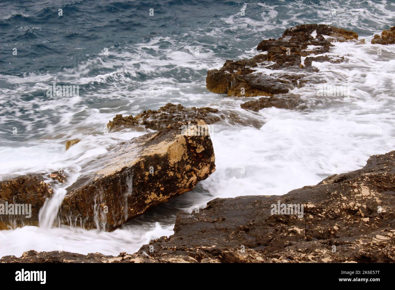 Coast rocks splashed by sea waves Stock Photo