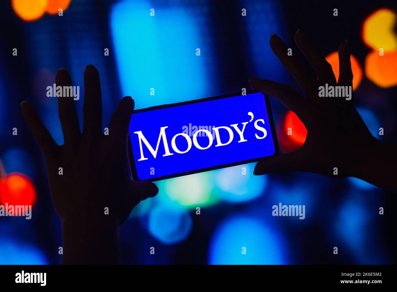 In this photo illustration, the Moody's Corporation logo is displayed