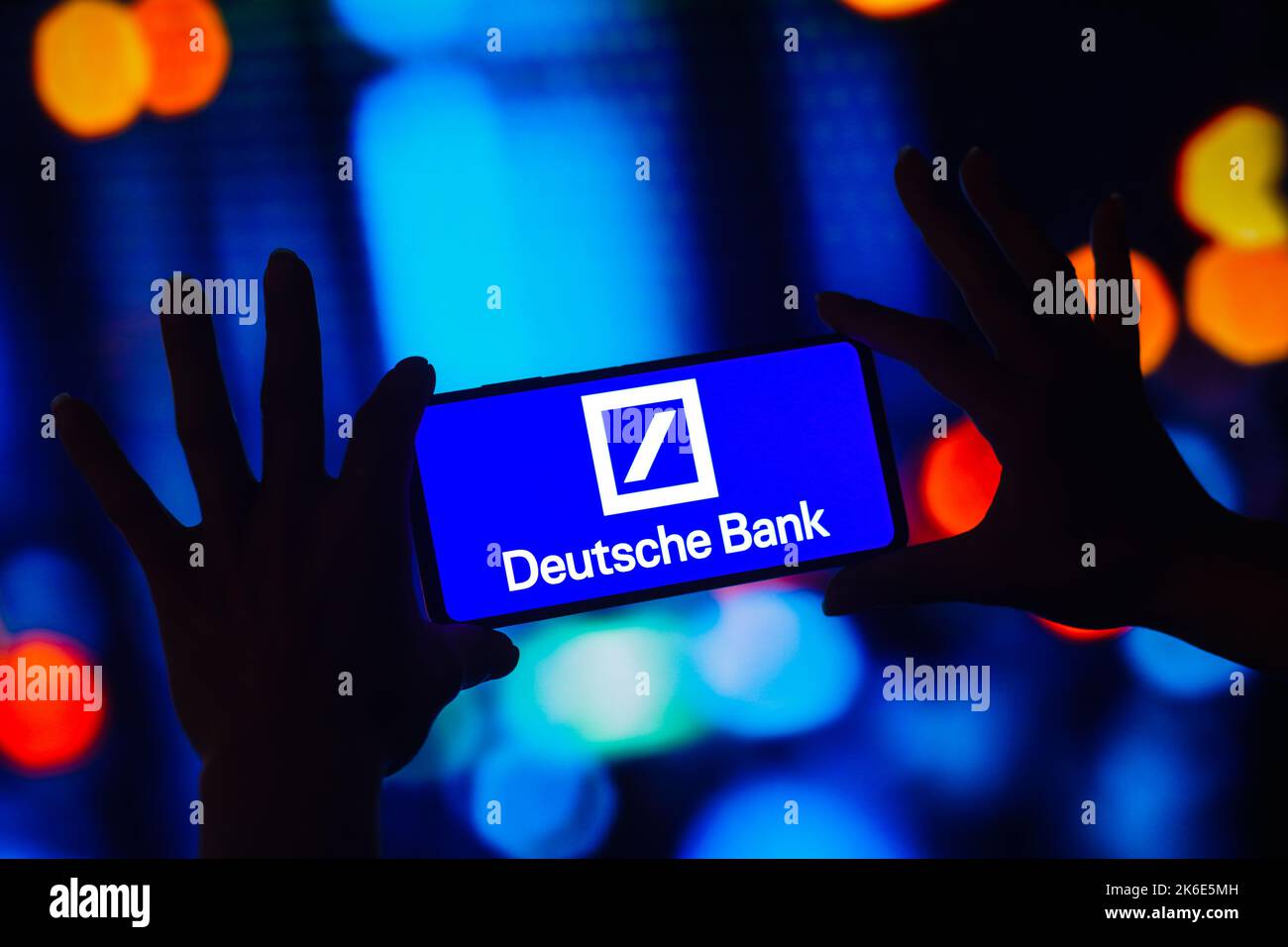 In this photo illustration, the Deutsche Bank logo is displayed on a smartphone screen. Stock Photo