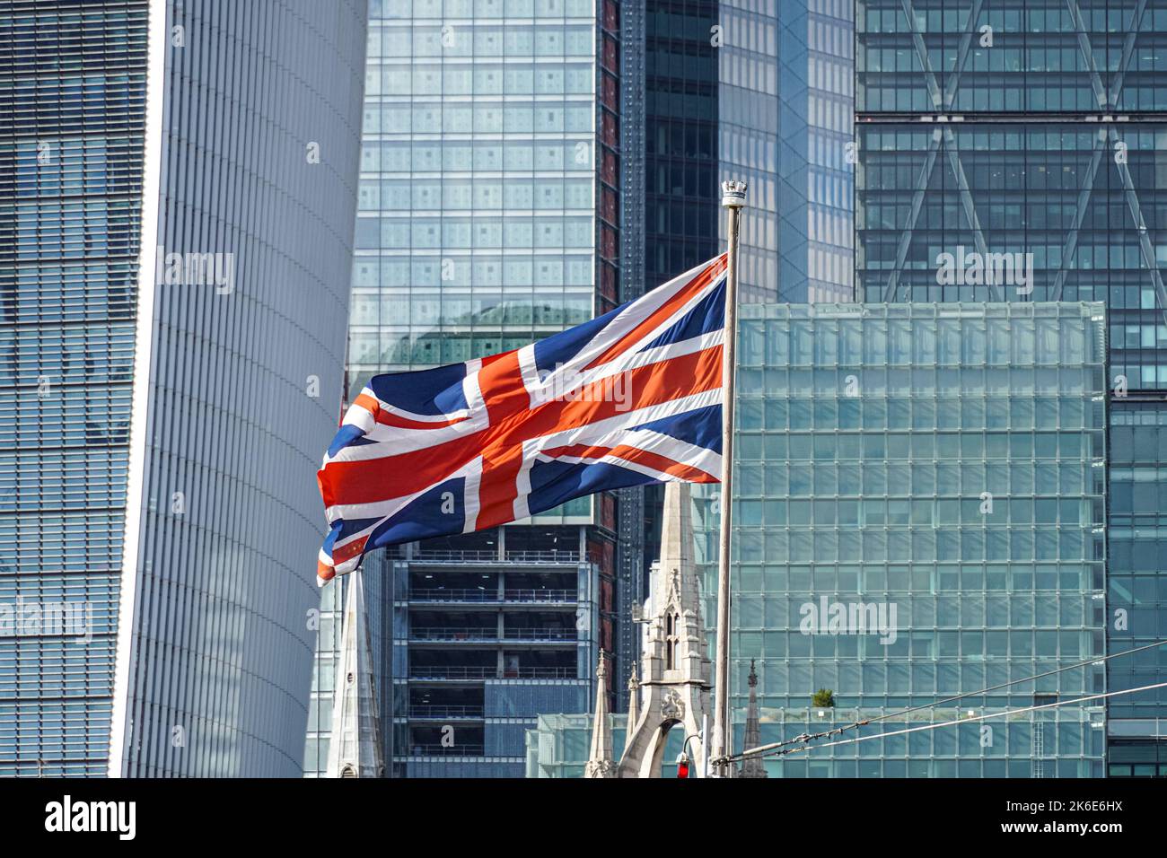 Union Jack flag in front of City of London skyscrapers, London England United Kingdom UK Stock Photo