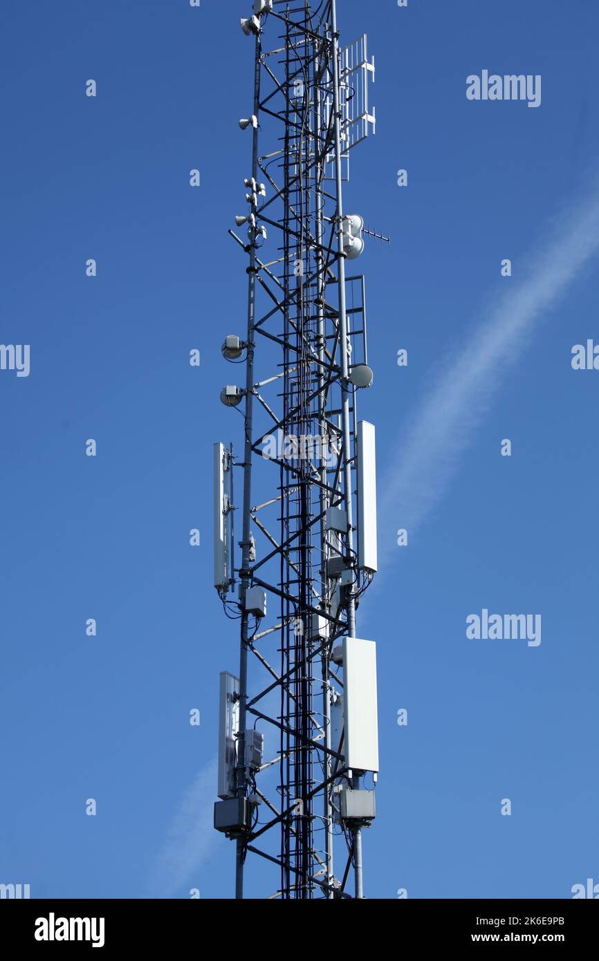 Telecommunications and good coverage is achieved via more and more mobile masts reaching all areas and with 5g coverage Stock Photo