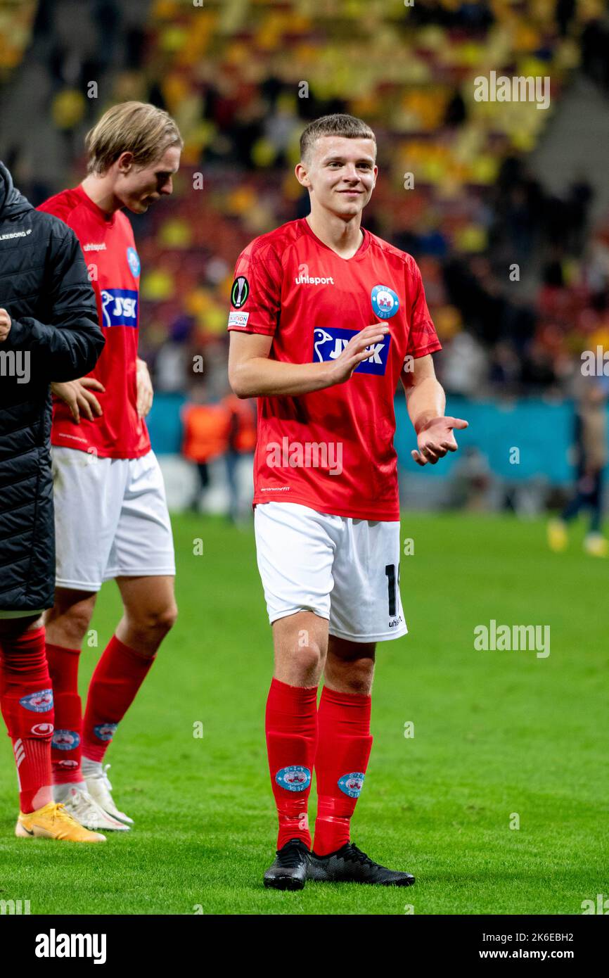 Bucharest, Romania. 14th Oct, 2022. October 14, 2022: Anders Braendsgaard Dahl #18 of Silkeborg IF greeting the fans at the end of the UEFA Europa Conference League group B match between FCSB Bucharest and Silkeborg IF at National Arena Stadium in Bucharest, Romania ROU. Catalin Soare/Cronos Credit: Cronos/Alamy Live News Stock Photo