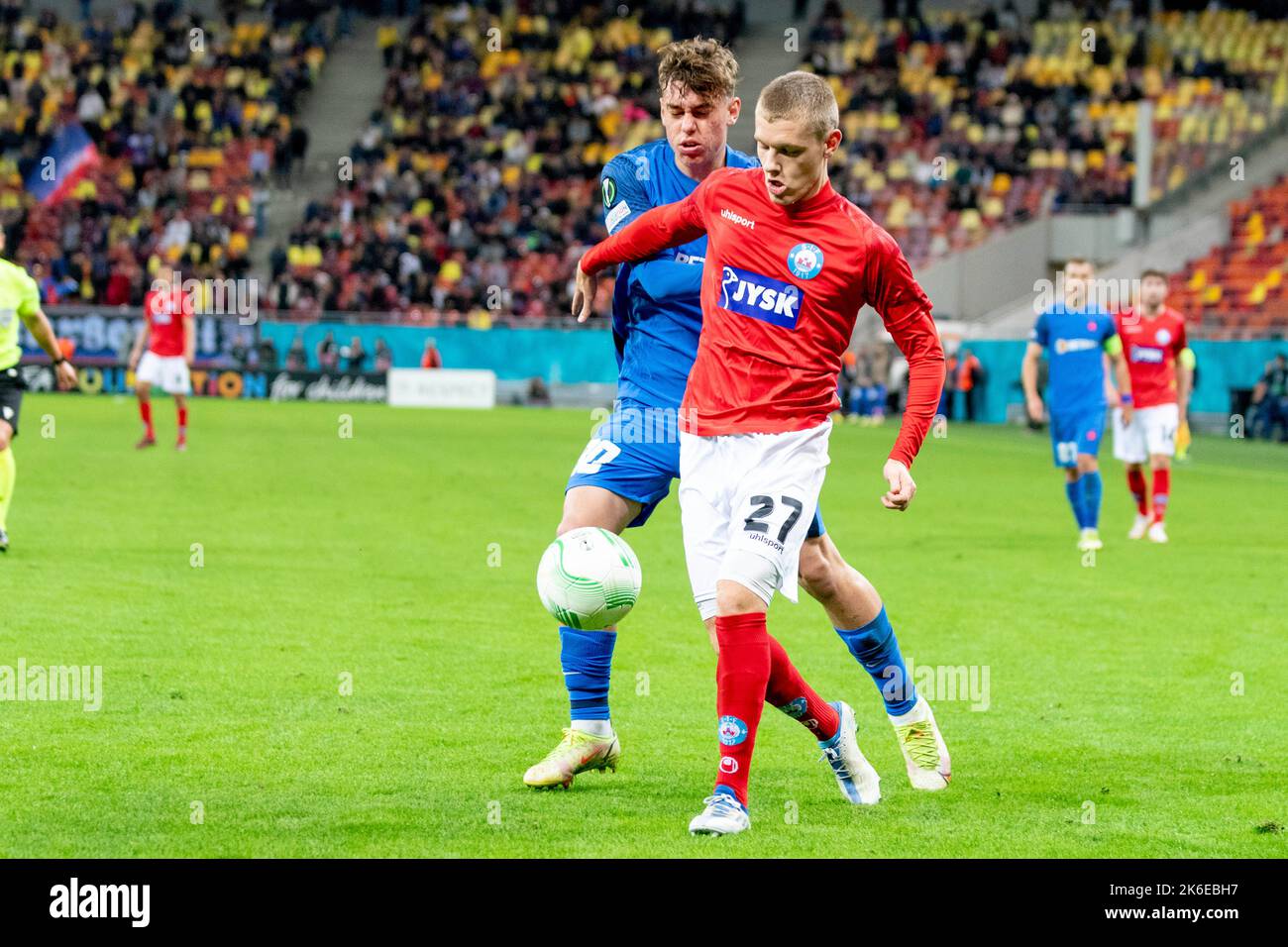 Bucharest, Romania. 14th Oct, 2022. October 14, 2022: Sebastian Jorgensen #27 of Silkeborg IF and Octavian Popescu #10 of FCSB during of the UEFA Europa Conference League group B match between FCSB Bucharest and Silkeborg IF at National Arena Stadium in Bucharest, Romania ROU. Catalin Soare/Cronos Credit: Cronos/Alamy Live News Stock Photo