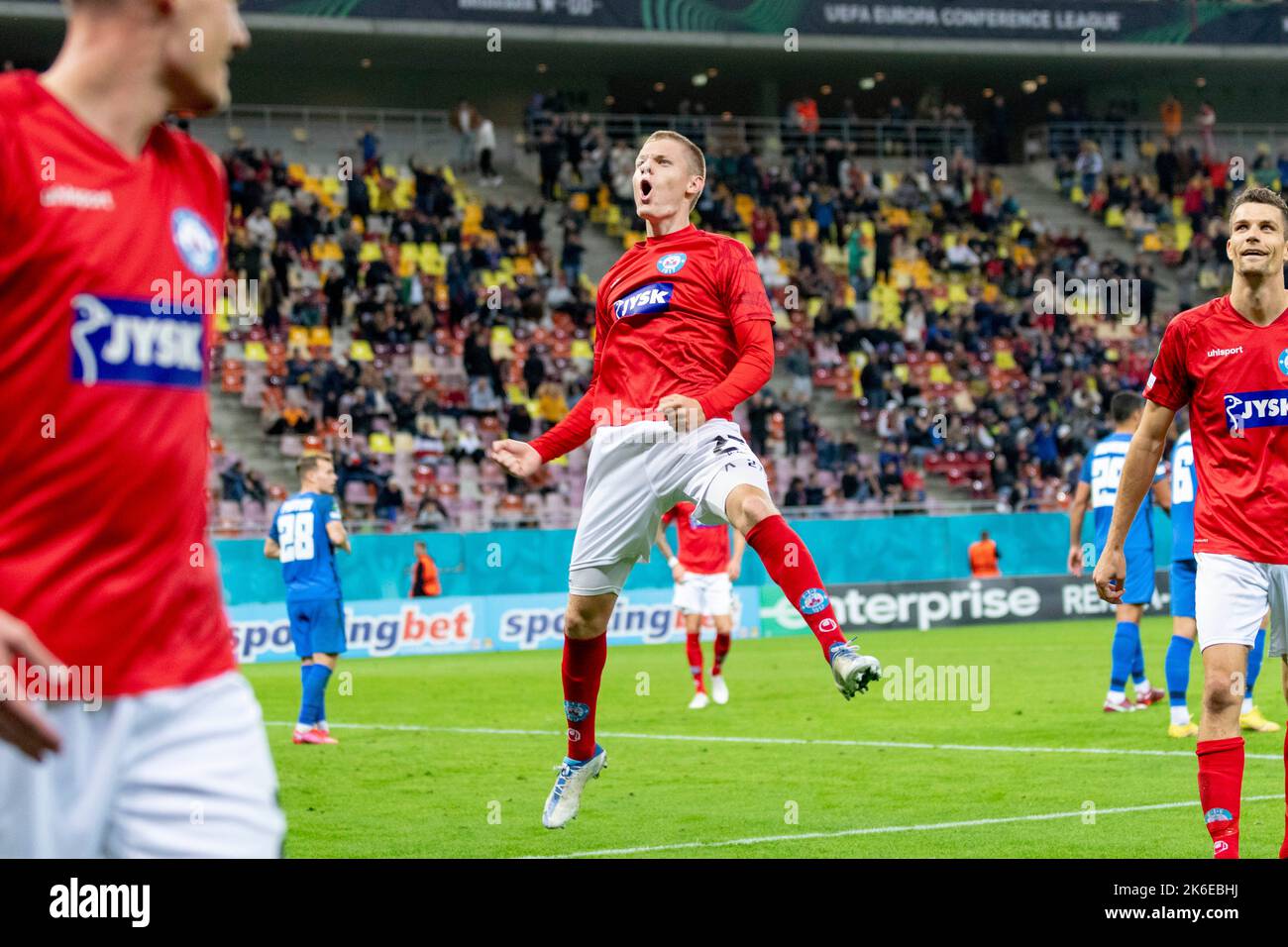 Bucharest, Romania. 14th Oct, 2022. October 14, 2022: Sebastian Jorgensen #27 of Silkeborg IF celebrating the 5th goal during of the UEFA Europa Conference League group B match between FCSB Bucharest and Silkeborg IF at National Arena Stadium in Bucharest, Romania ROU. Catalin Soare/Cronos Credit: Cronos/Alamy Live News Stock Photo