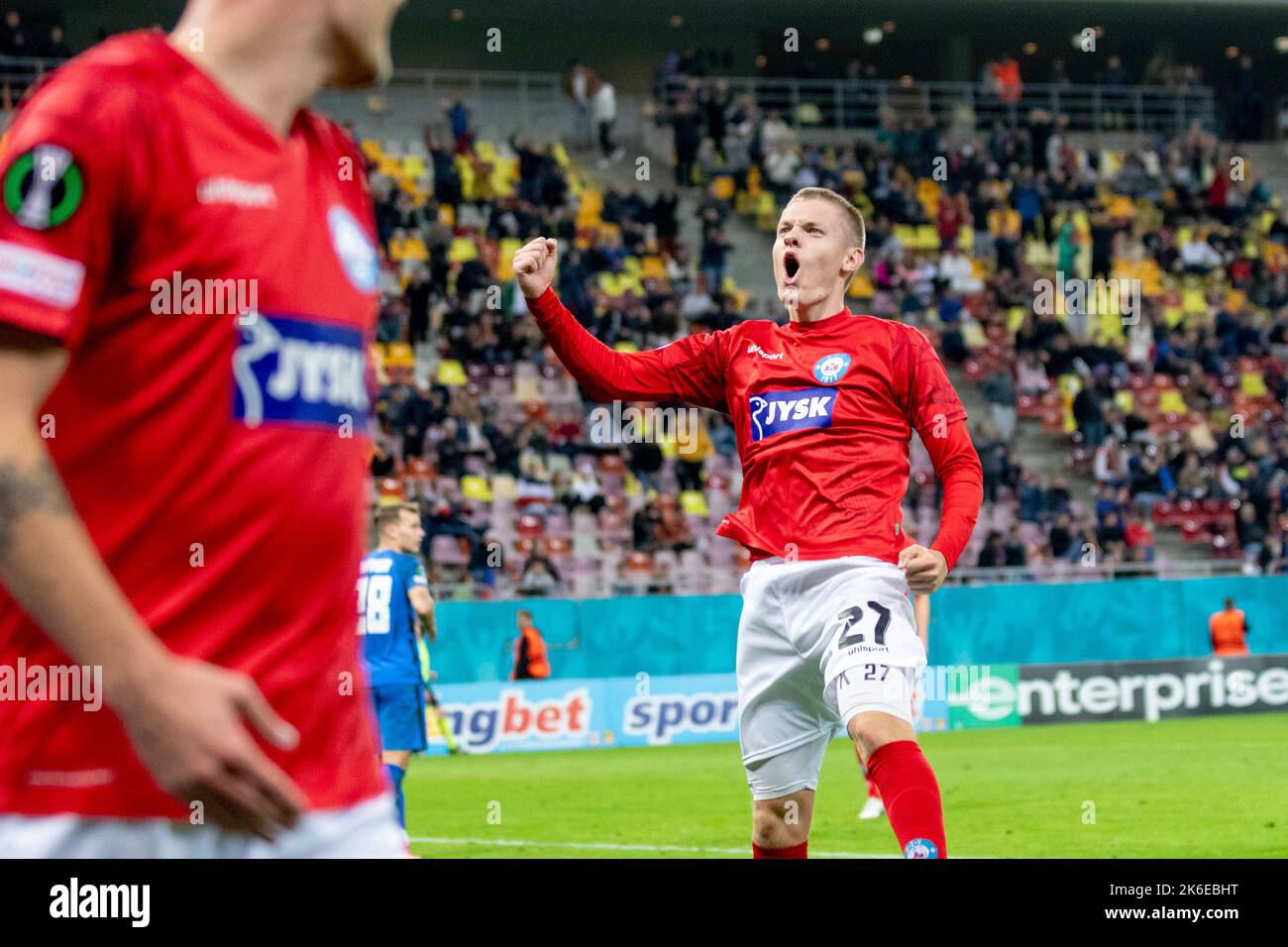 Bucharest, Romania. 14th Oct, 2022. October 14, 2022: Sebastian Jorgensen #27 of Silkeborg IF celebrating the 5th goal during of the UEFA Europa Conference League group B match between FCSB Bucharest and Silkeborg IF at National Arena Stadium in Bucharest, Romania ROU. Catalin Soare/Cronos Credit: Cronos/Alamy Live News Stock Photo