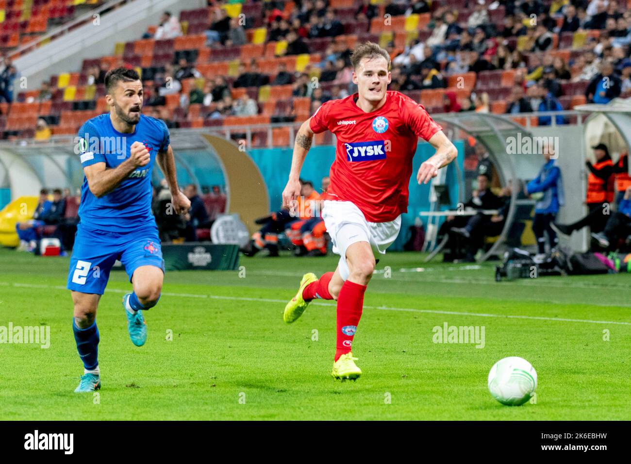 Bucharest, Romania. 14th Oct, 2022. October 14, 2022: Valentin Cretu #2 of FCSB and Lukas Engel #29 of Silkeborg IF during of the UEFA Europa Conference League group B match between FCSB Bucharest and Silkeborg IF at National Arena Stadium in Bucharest, Romania ROU. Catalin Soare/Cronos Credit: Cronos/Alamy Live News Stock Photo
