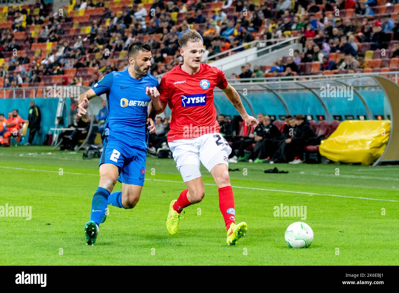 Bucharest, Romania. 14th Oct, 2022. October 14, 2022: Valentin Cretu #2 of FCSB and Lukas Engel #29 of Silkeborg IF during of the UEFA Europa Conference League group B match between FCSB Bucharest and Silkeborg IF at National Arena Stadium in Bucharest, Romania ROU. Catalin Soare/Cronos Credit: Cronos/Alamy Live News Stock Photo