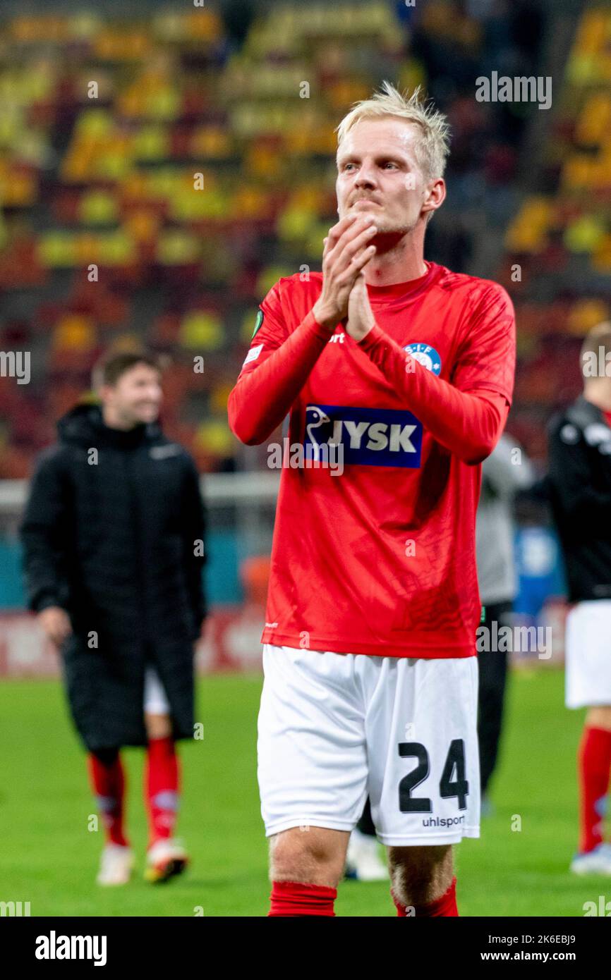 Bucharest, Romania. 14th Oct, 2022. October 14, 2022: Andreas Oggesen #24 of Silkeborg IF greeting the fans at the end of the UEFA Europa Conference League group B match between FCSB Bucharest and Silkeborg IF at National Arena Stadium in Bucharest, Romania ROU. Catalin Soare/Cronos Credit: Cronos/Alamy Live News Stock Photo