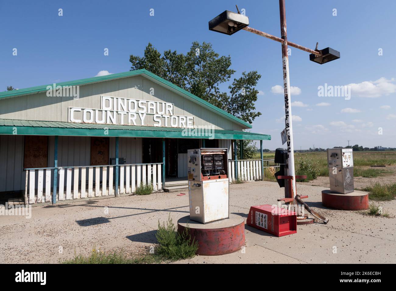 Gas pumps sit unused at the abandoned Dinosaur Country Store near Brooks, Alberta, Canada. Stock Photo
