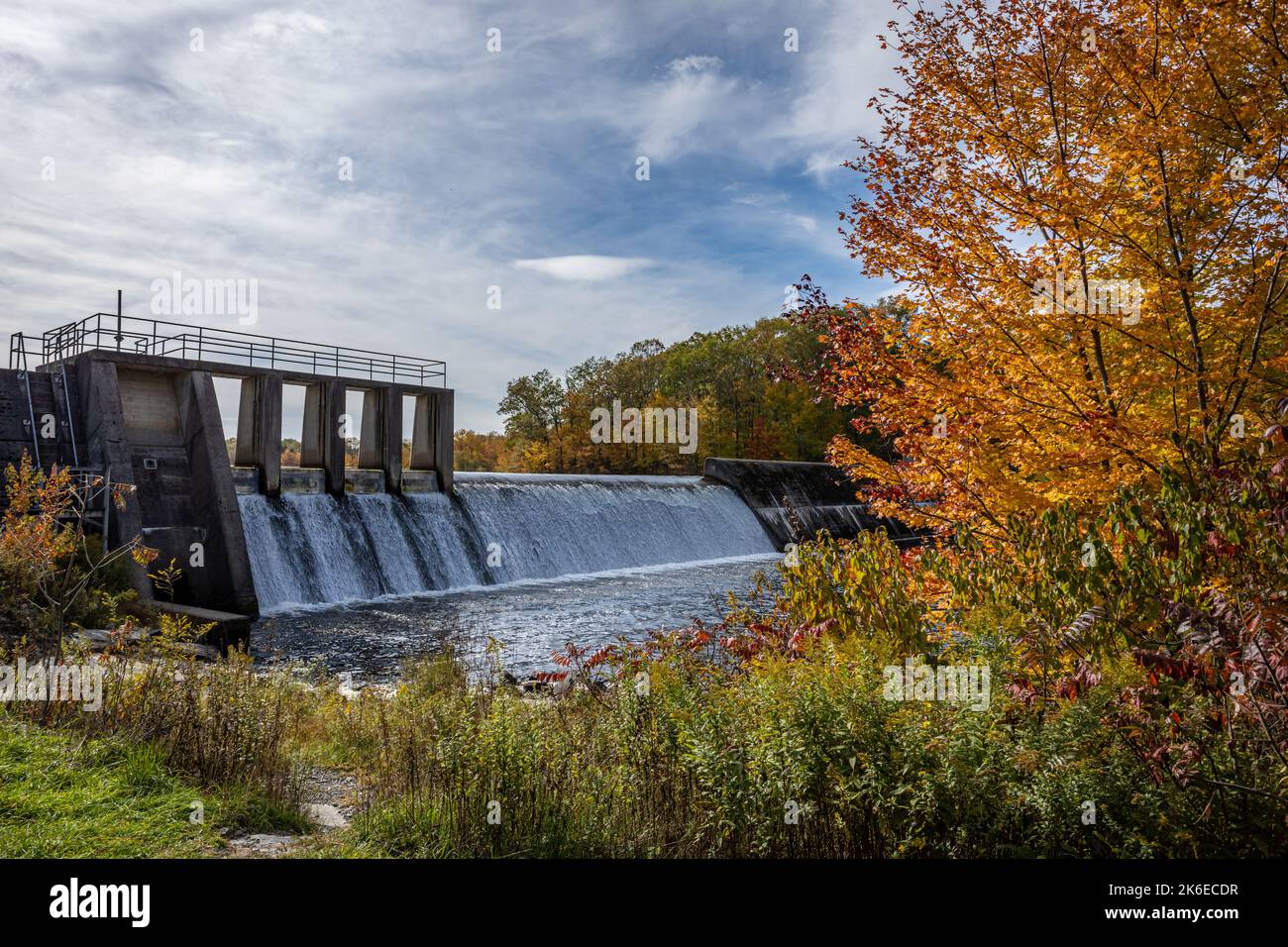Shohola Falls Dam in the Poconos, PA, is surrounded by beautiful fall foliage Stock Photo