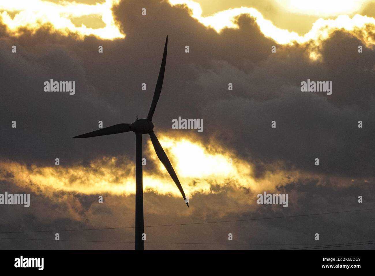 Wind turbine blades on stormy sky background Stock Photo
