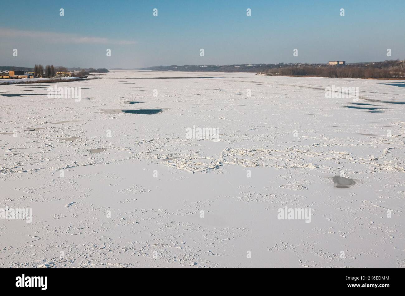 Frozen river covered with ice in Europe Stock Photo