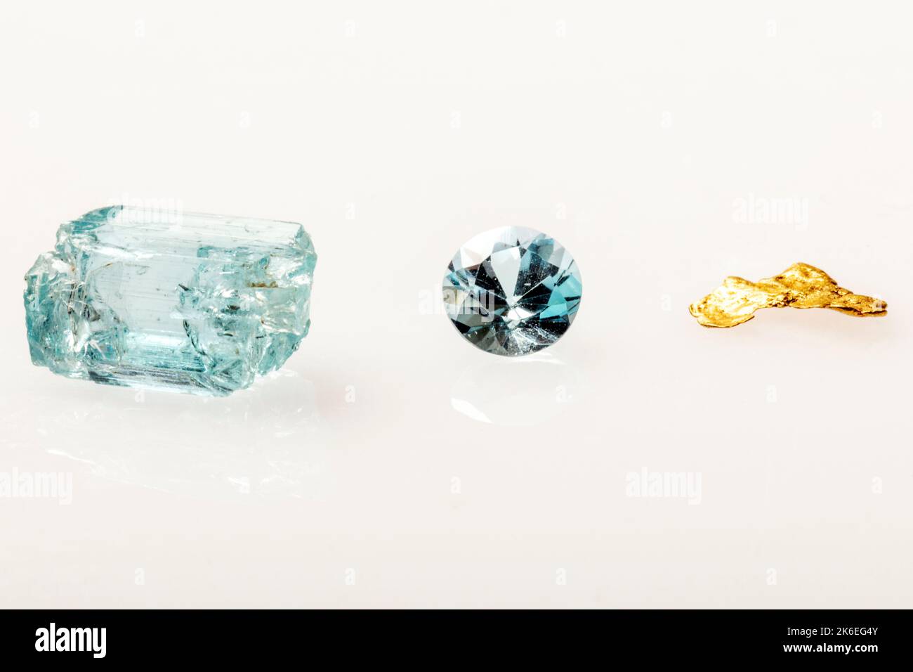 Raw aquamarine; faceted aquamarine gemstone & gold nugget mined by famous prospector; Brian Busse; American Gemtracker; Colorado; USA Stock Photo
