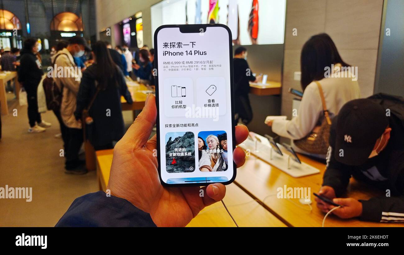 SHANGHAI, CHINA - OCTOBER 13, 2022 - Customers experience the new iPhone 14 series smartphones at the Apple Inc flagship store in Shanghai, China, Oct Stock Photo