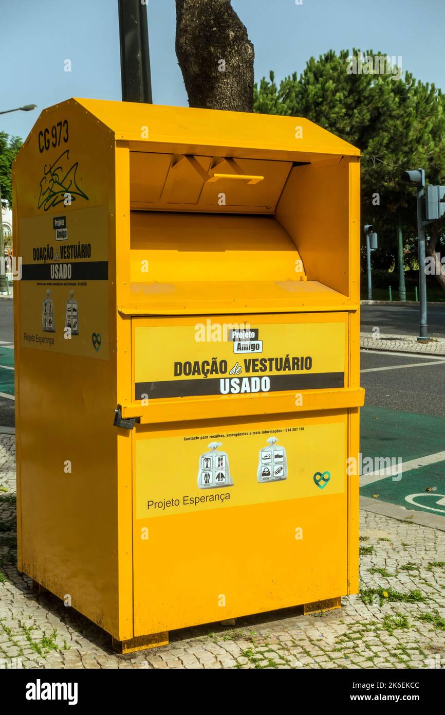 Donation box for recycling used clothes on street in Lisbon, Portugal Stock Photo