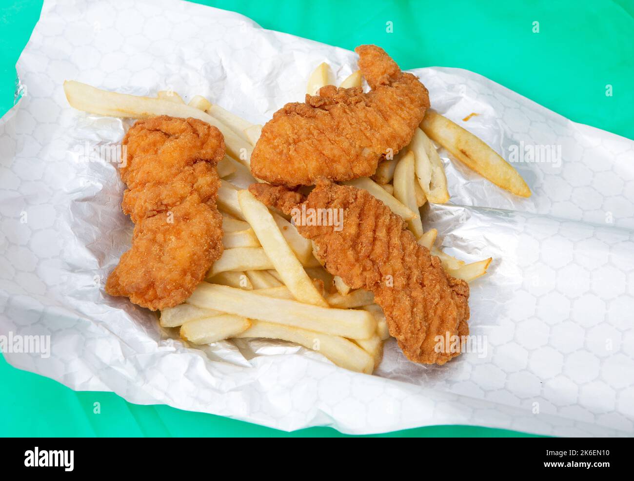 Chicken tenders and French fries at a local festival event Stock Photo