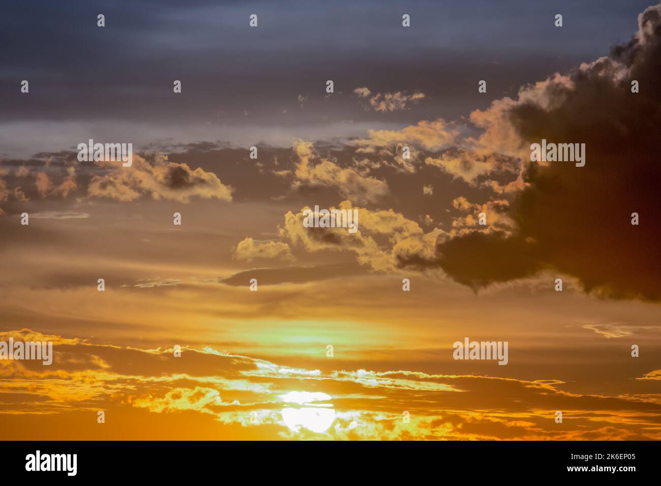Sunrise dramatic sky with clouds in a row, colorful cloudscape Stock Photo