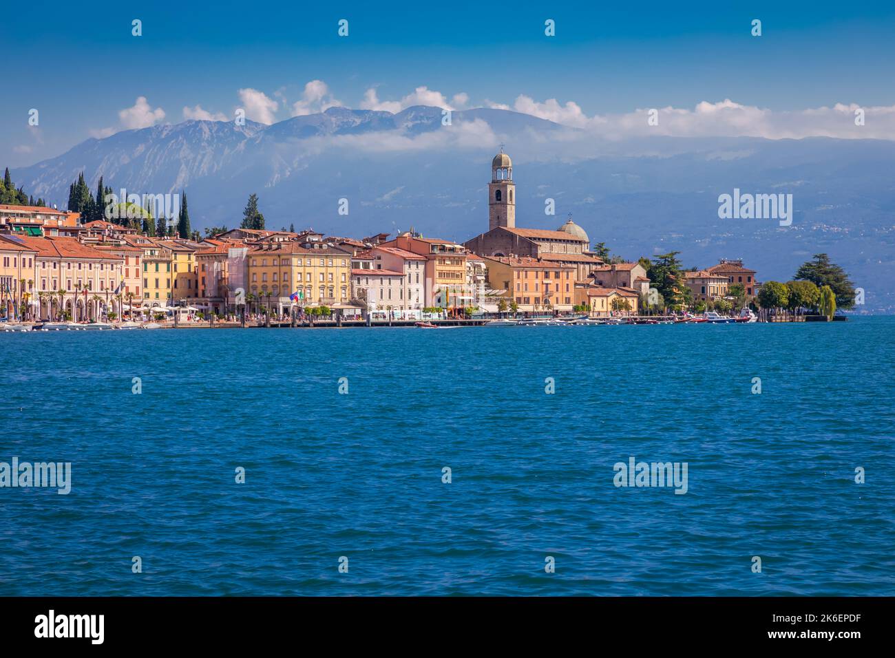 Idyllic lake Garda coastline and mediterranean village with sailboats, Italy Stock Photo