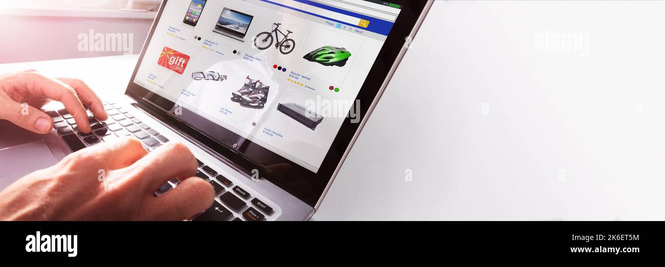 Person Purchasing Using Credit Card On Computer Stock Photo