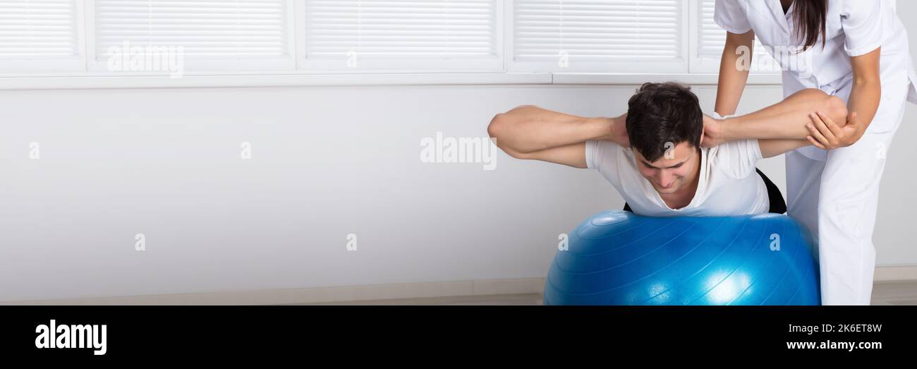 Physiotherapy Balance Exercise. Physiotherapist Ball Training Therapy Stock Photo
