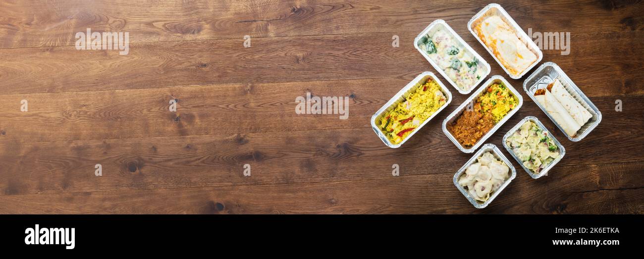 Meal prep containers with rice with chicken, baked vegetables, eggs,  sausages and salad for breakfast and lunch overhead shot, copy space, wtite  woode Stock Photo - Alamy