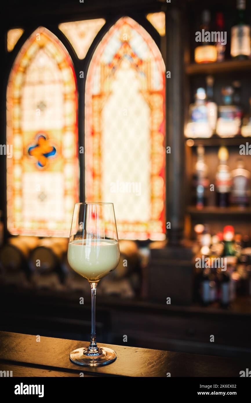 Glass of alcohol on a bar counter Stock Photo Alamy