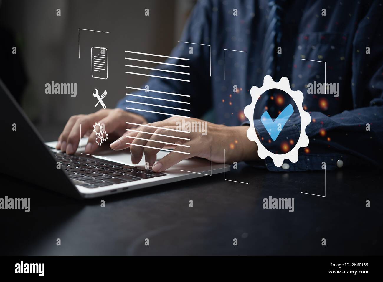 Businessman using laptop computer with quality assurance and document icon for ISO management strategy marketing technology concept. Stock Photo