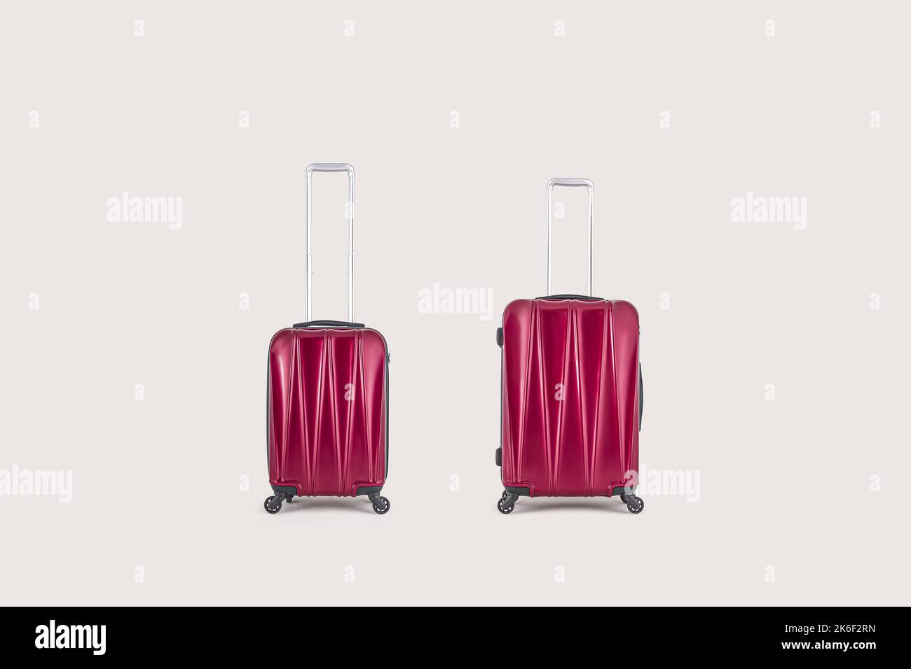 Stylish red suitcases isolated on white background Stock Photo