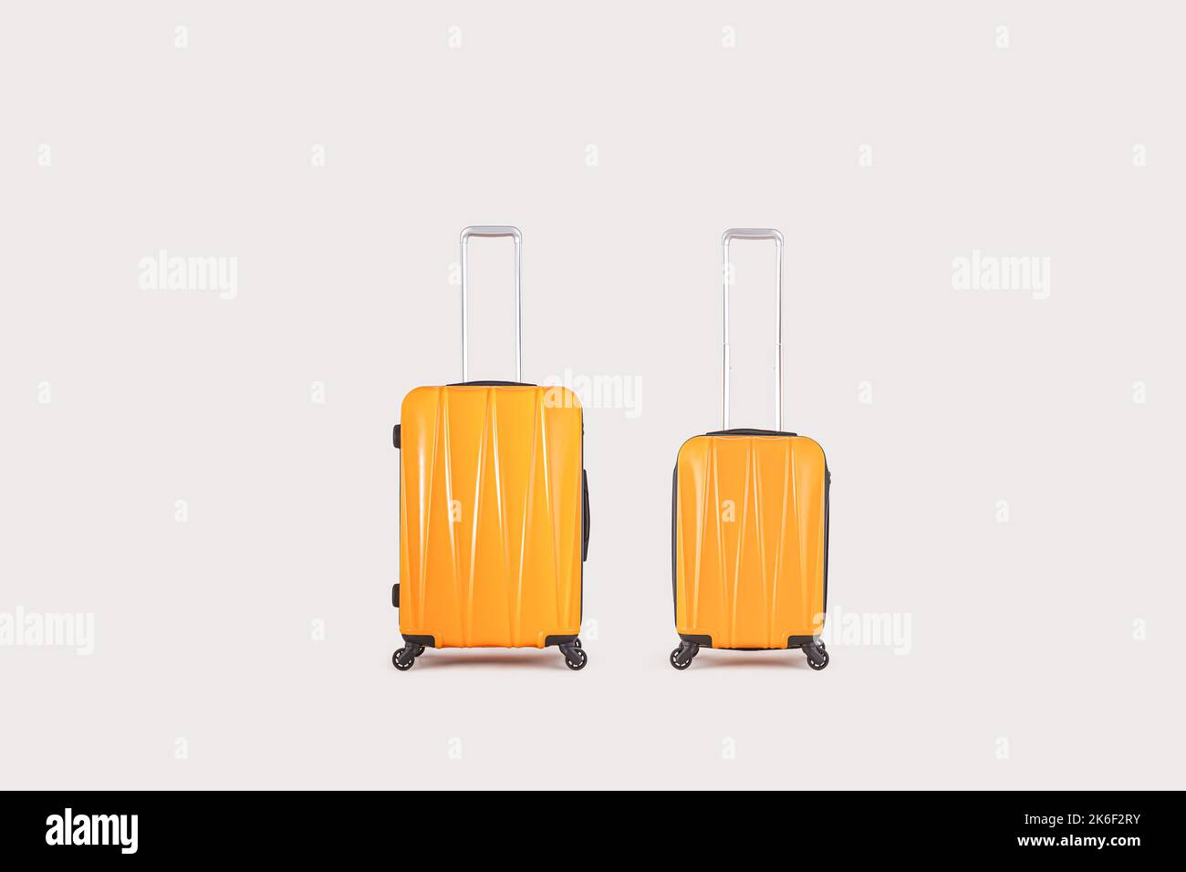 Stylish yellow suitcases isolated on white background Stock Photo