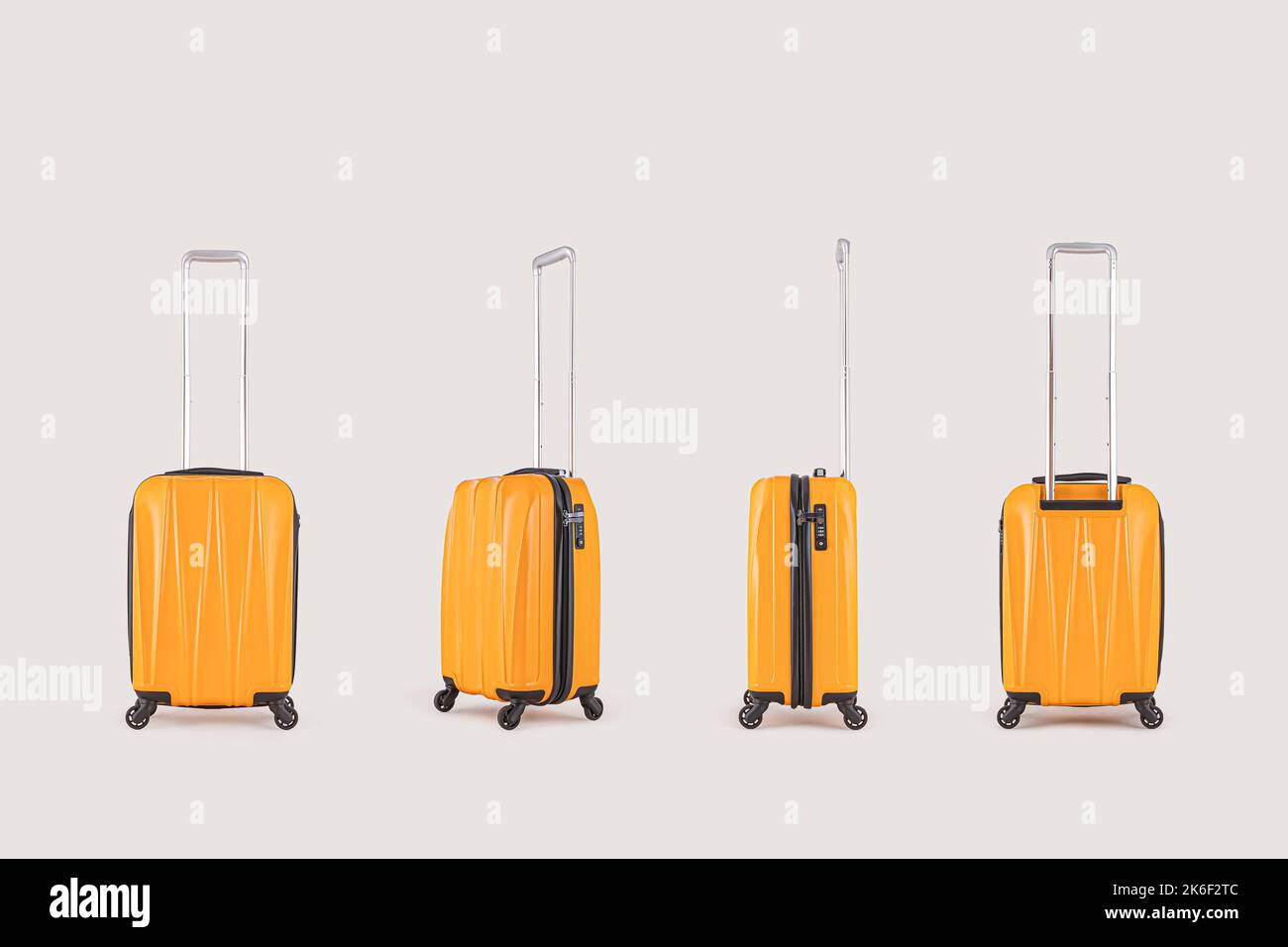 Set up of stylish yellow suitcases isolated on white background Stock