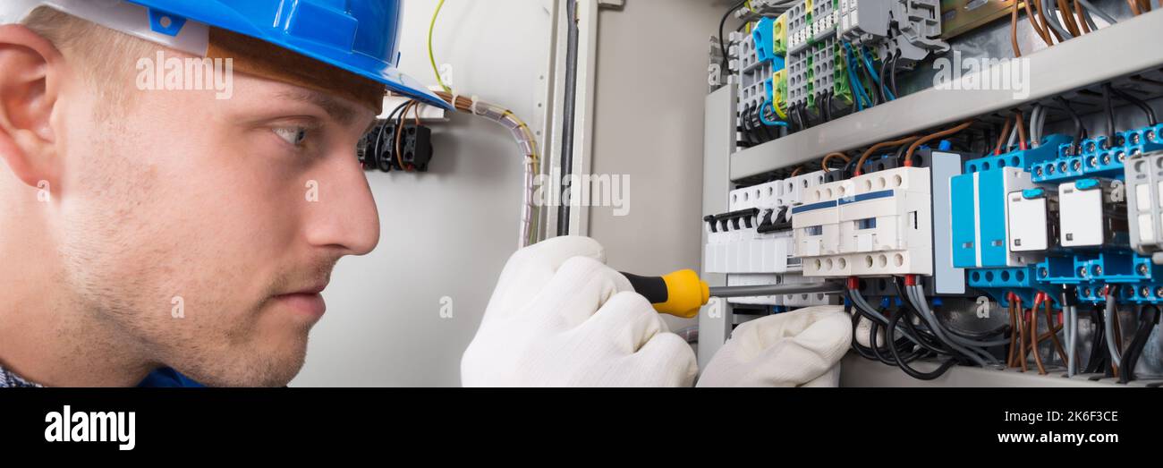 Electrician Worker With Electric Equipment. Repairman Electricity Tester Stock Photo