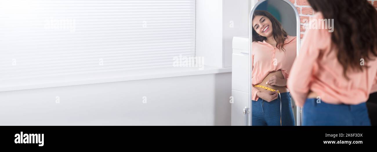 Fat And Weight Loss In Mirror. Stomach Size Stock Photo Alamy