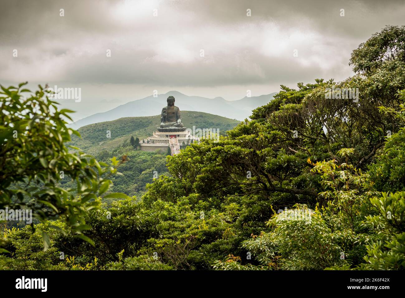 The Tian Tan Buddha (aka The Big Buddha), a major tourist attraction, sits on a hilltop on Lantau Island, Hong Kong Stock Photo