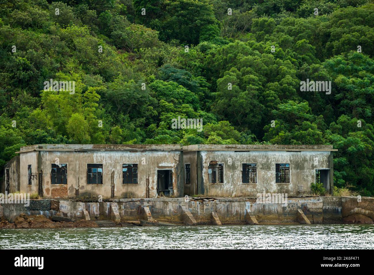 Abandoned buildings of a former pearl oyster farm in Lo Fu Wat, a secluded cove on the northern shore of Tolo Channel, New Territories, Hong Kong Stock Photo
