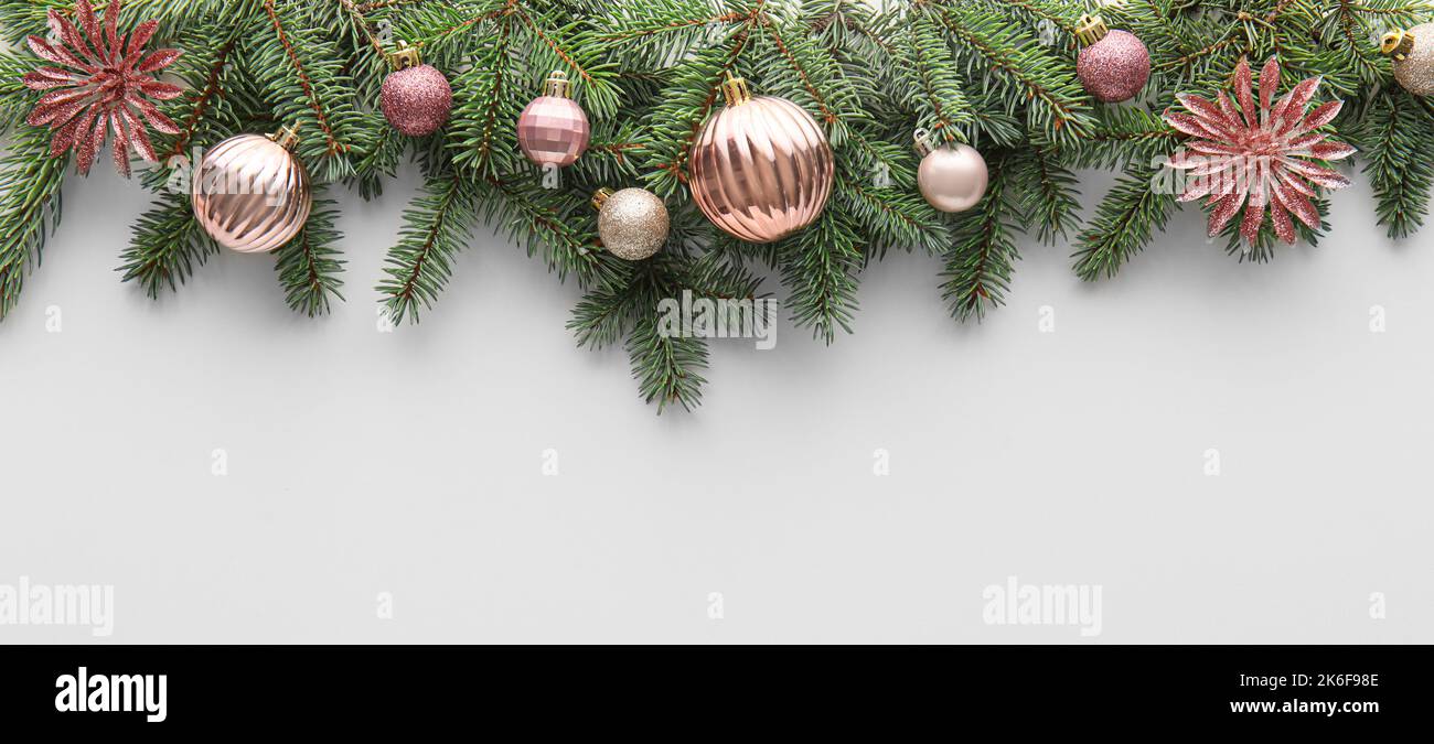 Fir tree branches and Christmas balls on white background Stock Photo ...