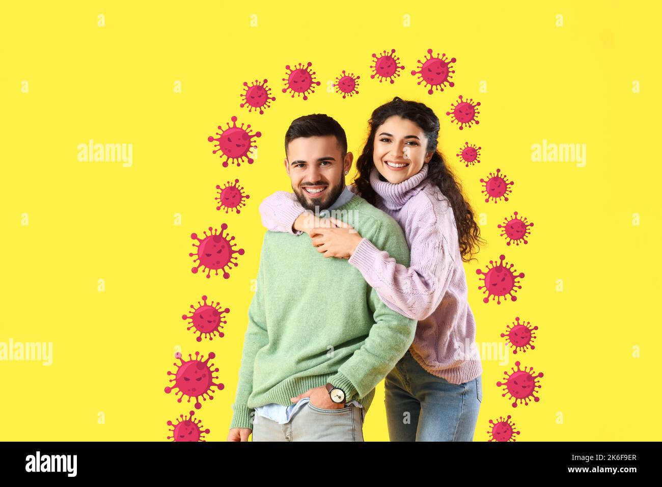 Happy young couple and drawn virus on yellow background. Concept of