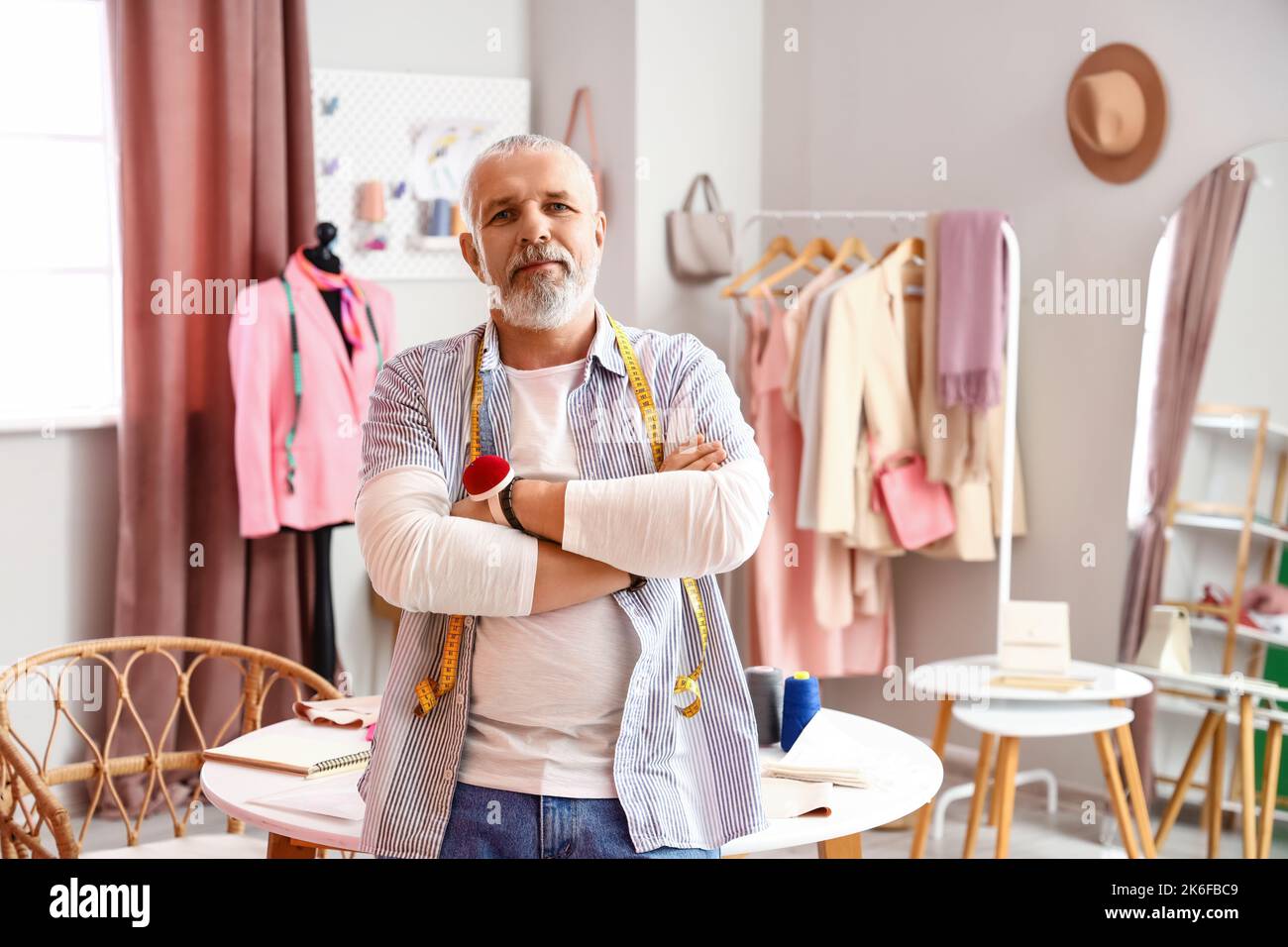 Mature fashion designer in studio Stock Photo
