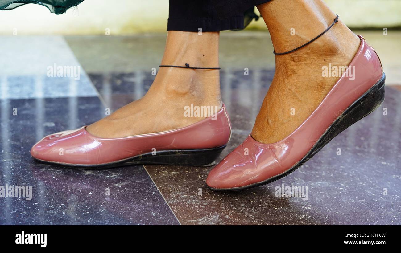 women's shoes with their feet on. Close up of stylish female shoes. Outdoor fashion shoes footwear concept. Stock Photo